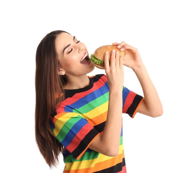 Jovem Mulher Comendo Hambúrguer Saboroso Fundo Branco — Fotografia de Stock