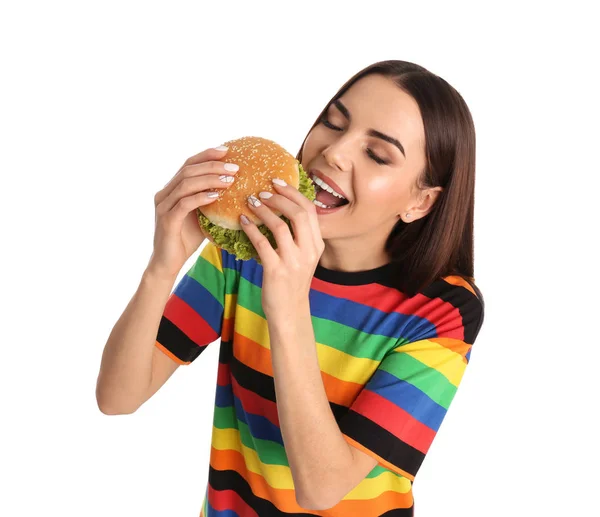 Jovem Mulher Comendo Hambúrguer Saboroso Fundo Branco — Fotografia de Stock