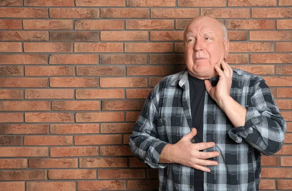 Senior Man Suffering Cough Brick Wall Space Text — Stock Photo, Image