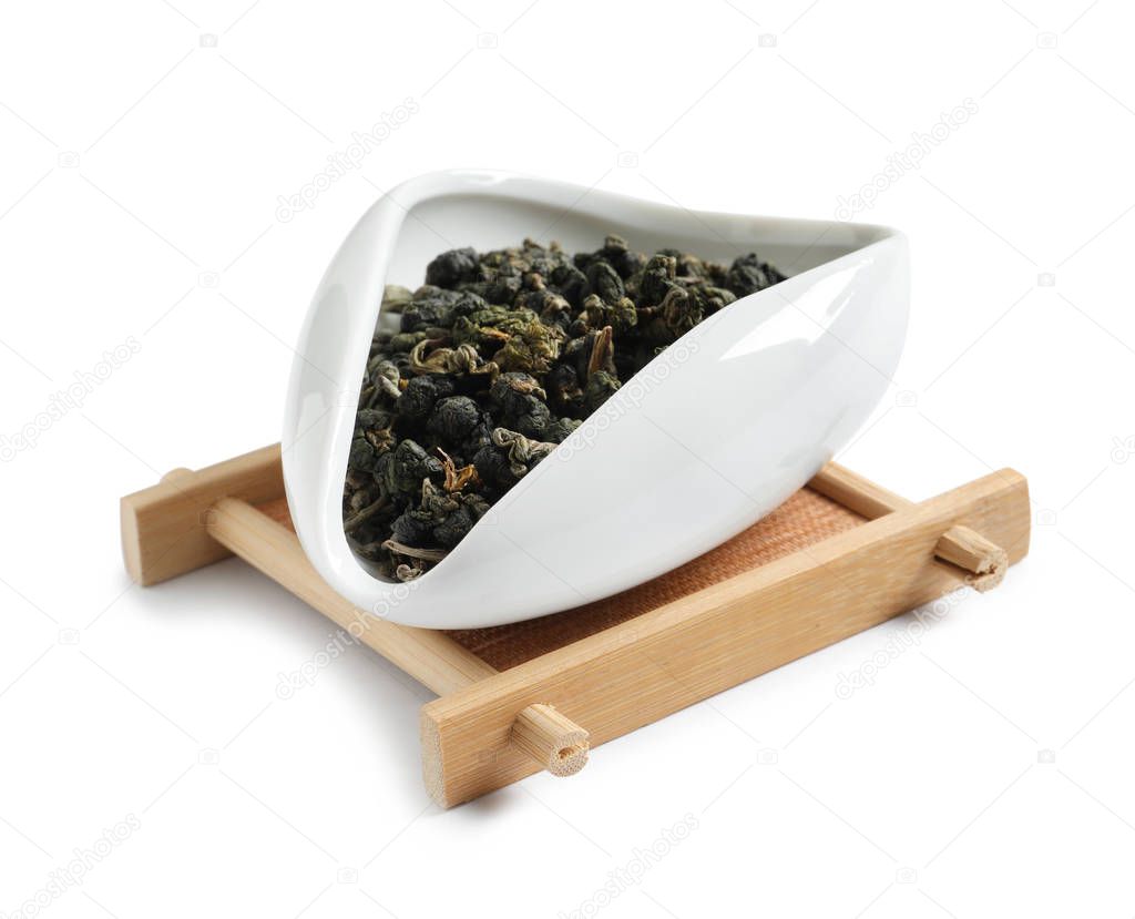 Bowl with Ali Shan Oolong tea on white background