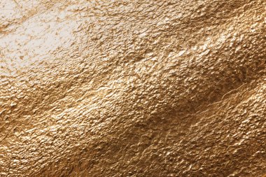 Arka plan, üstten görünüm olarak altın pütürlü yüzeyi