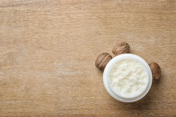 Jar Shea Butter Nuts Space Text Wooden Background Top View — Stock Photo, Image