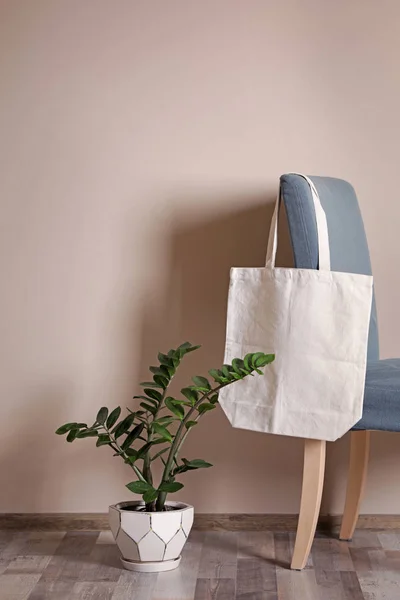 Eco tote bag in room interior. Space for design