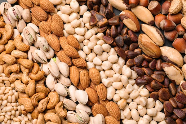 Organische gemengde noten als achtergrond, bovenaanzicht — Stockfoto
