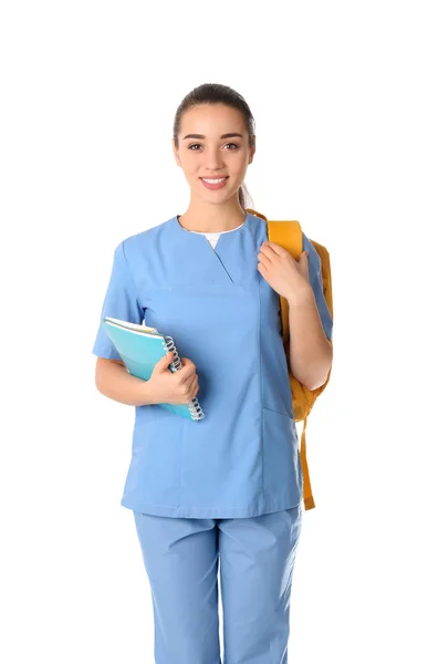 Junge Medizinstudentin mit Rucksack auf weißem Hintergrund — Stockfoto