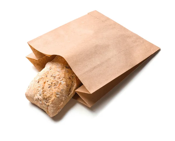 Paper bag with bread on white background. Space for design — Stock Photo, Image
