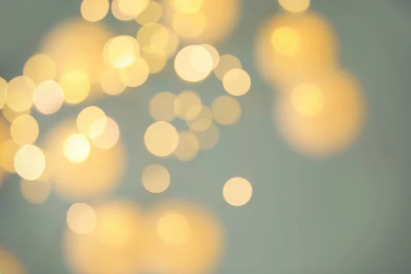 Blurred view of shiny gold lights. Bokeh effect — Stock Photo, Image