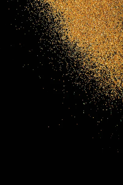 Glitter oro su sfondo nero, vista dall'alto con spazio per il testo — Foto Stock