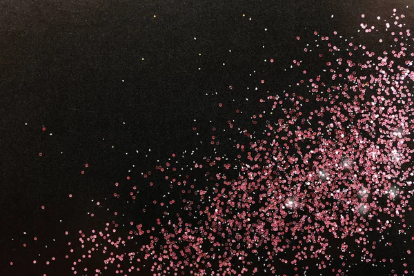 Ροζέ χρυσό γκλίτερ σε μαύρο φόντο, το top view με χώρο για κείμενο — Φωτογραφία Αρχείου
