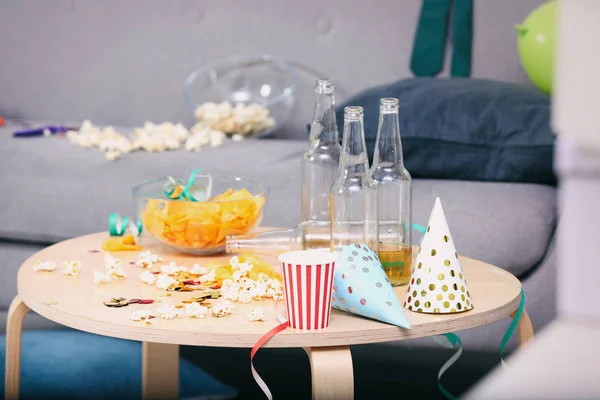 Wooden table with mess after party indoors