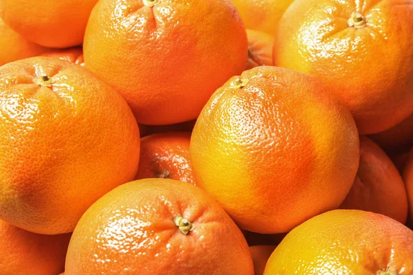 Mnoho čerstvých zralých grapefruitů jako pozadí, closeup — Stock fotografie