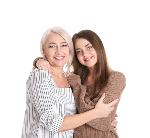Portrait of young woman with her mature mother on white background — Stock Photo, Image