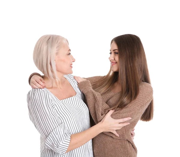 Portrait of young woman with her mature mother on white background — Stock Photo, Image