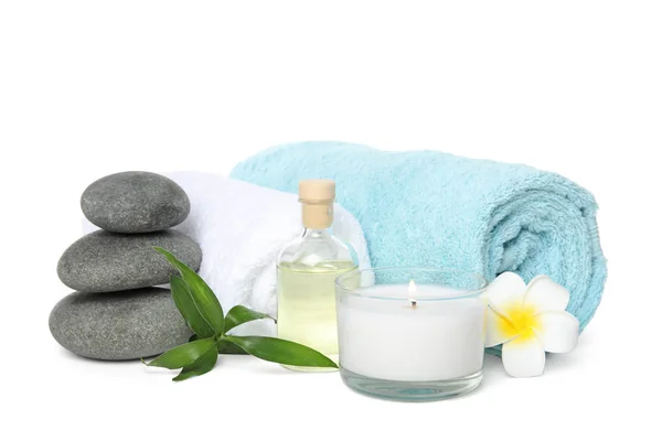 Beautiful spa composition with candle and stones on white background Stock Photo