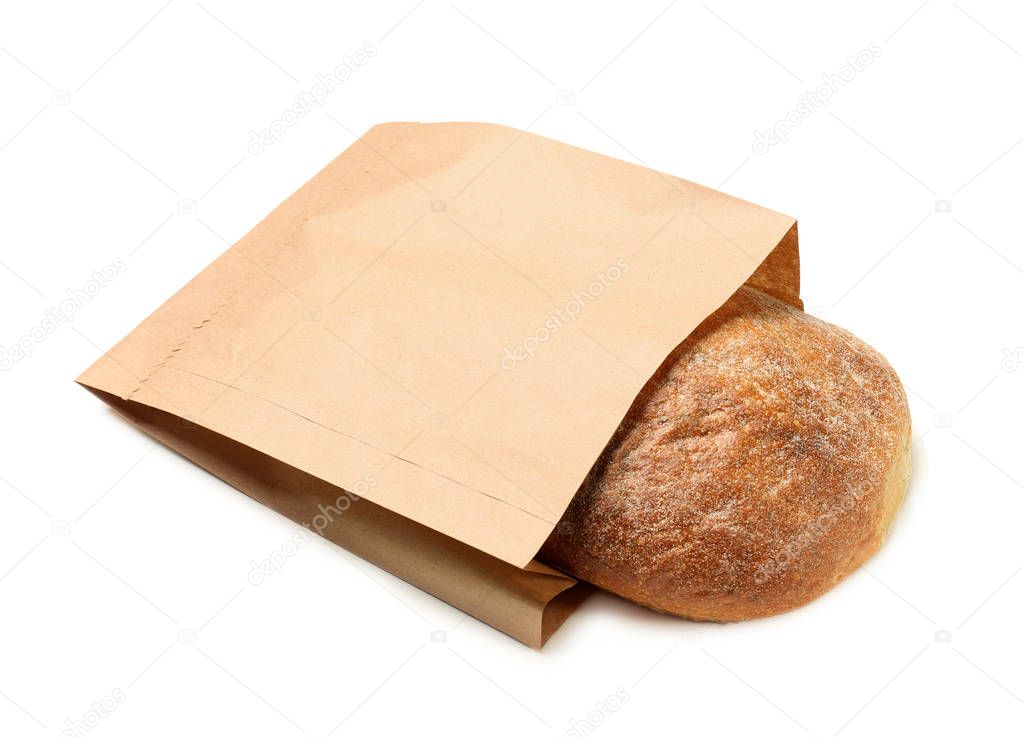 Paper bag with bread on white background. Space for design