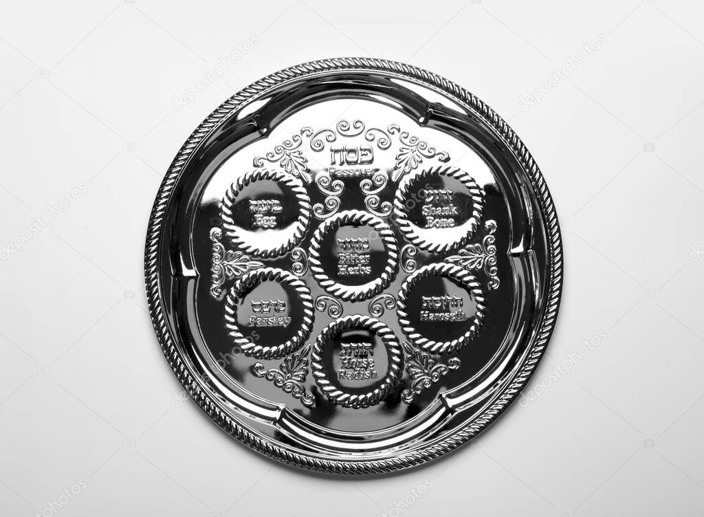 Empty traditional Passover (Pesach) Seder plate on white background, top view