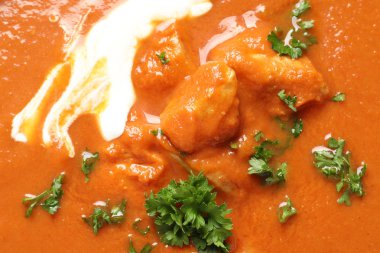Arka plan, closeup olarak lezzetli tereyağı tavuk. Geleneksel Murgh Makhani çanak
