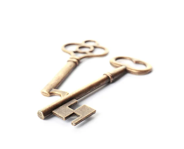 Bronze vintage ornate keys on white background — Stock Photo, Image