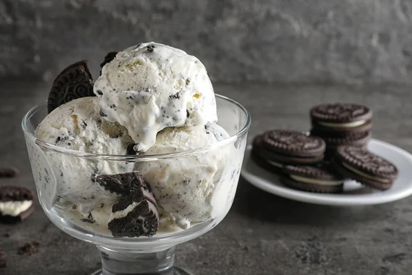 Bowl of chocolate cookies ice cream on table, closeup. Space for text — Stock Photo, Image