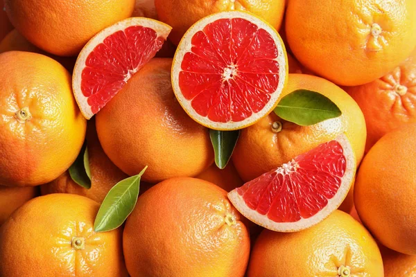 Many fresh ripe grapefruits as background, top view — Stock Photo, Image