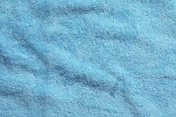 Zmięty miękki ręcznik frotte jako tło. Przestrzeń dla projektu — Zdjęcie stockowe