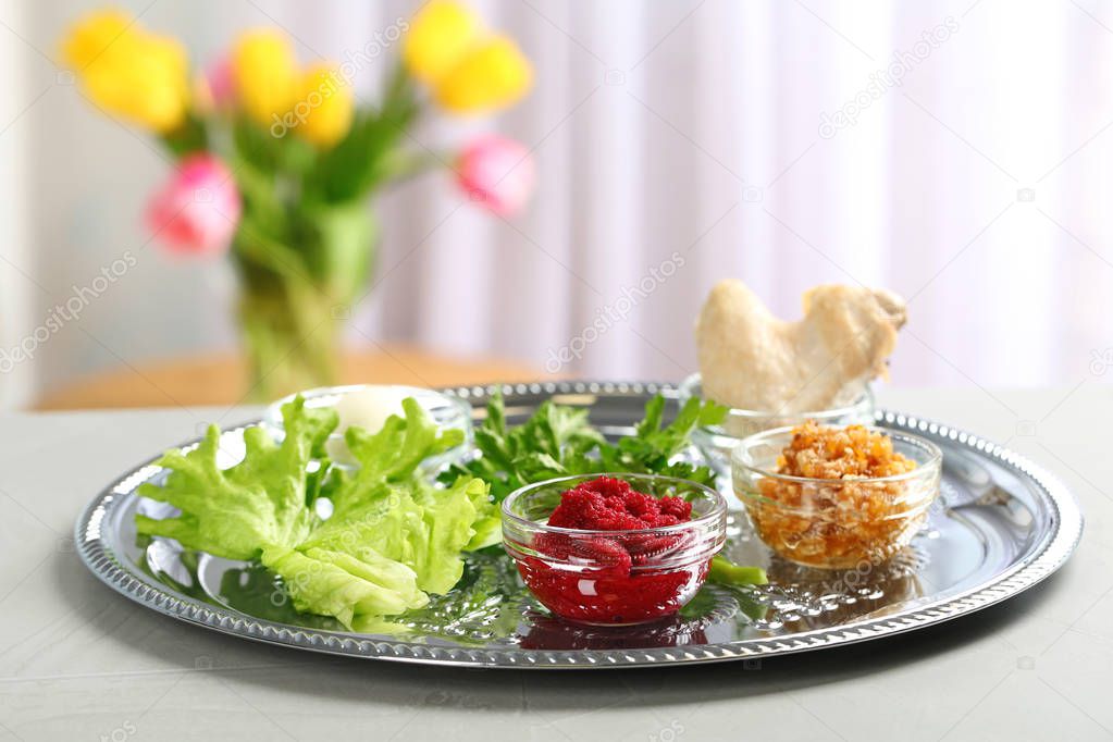 Traditional Passover (Pesach) Seder plate with symbolic meal on table indoors, space for text