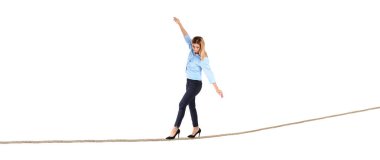 Full length portrait of businesswoman balancing on white background clipart