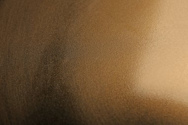 Arka plan olarak düz altın yüzeyinin güzel manzara