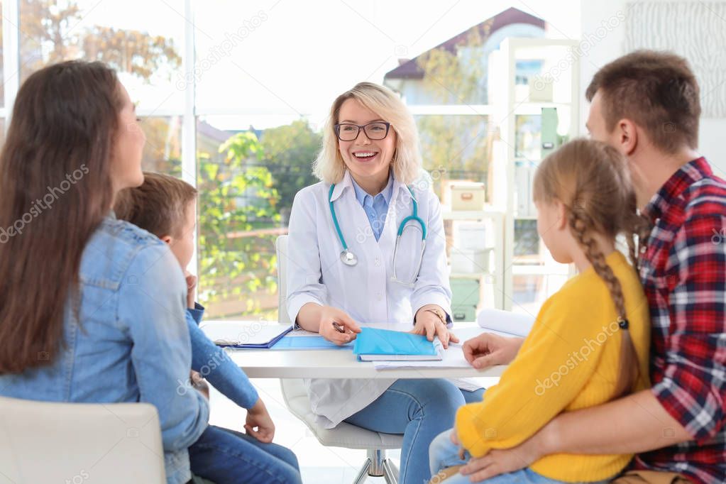 Little children with parents visiting doctor in hospital