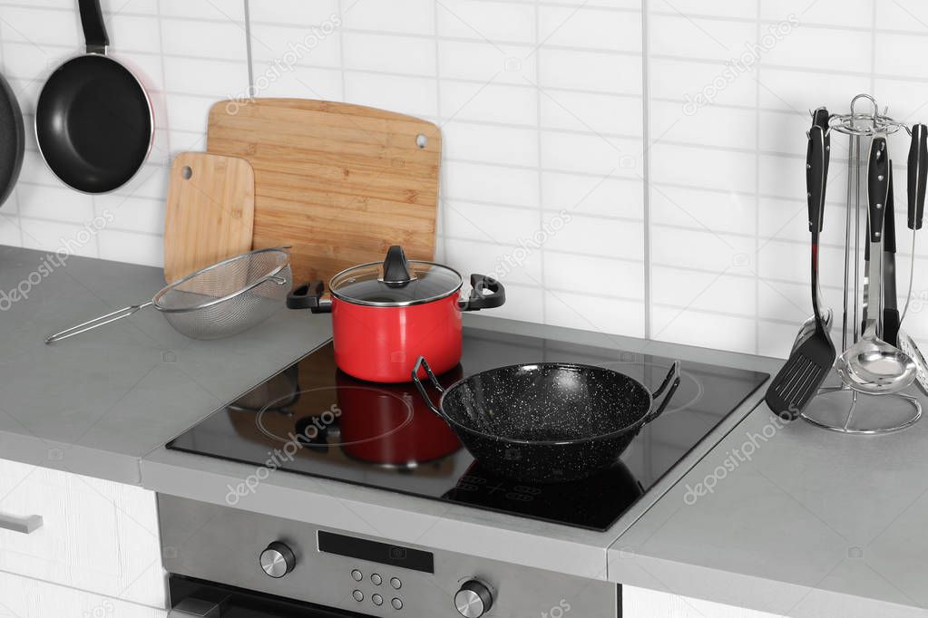 Clean cookware and utensils in modern  kitchen