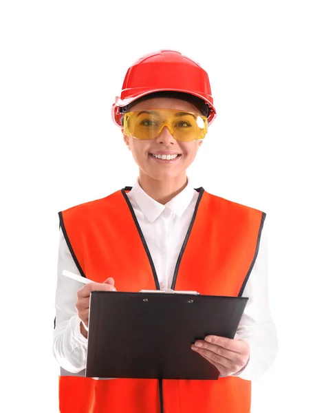 Wirtschaftsingenieurin in Uniform mit Klemmbrett auf weißem Hintergrund. Sicherheitsausrüstung — Stockfoto