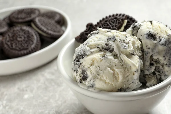 Bowl of chocolate cookies ice cream on table, closeup. Space for text — Stock Photo, Image