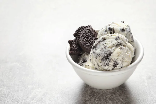 Bowl of chocolate cookies ice cream on table. Space for text — Stock Photo, Image