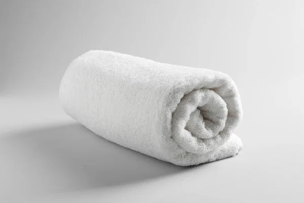 Fresh soft rolled towel on light background — Stock Photo, Image