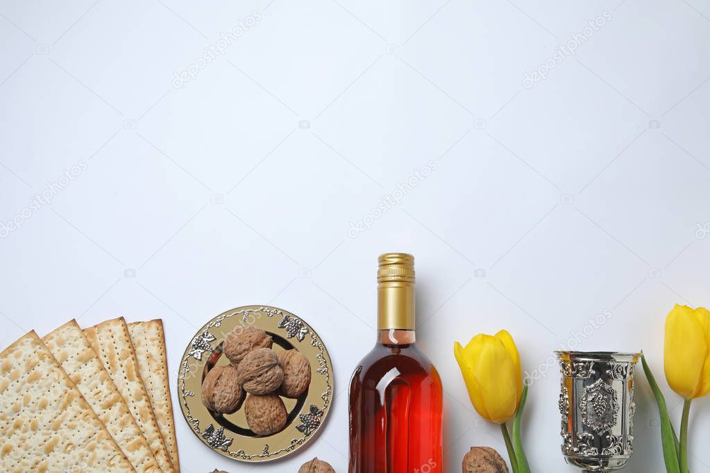 Composition with symbolic Passover (Pesach) items on white background, top view. Space for text