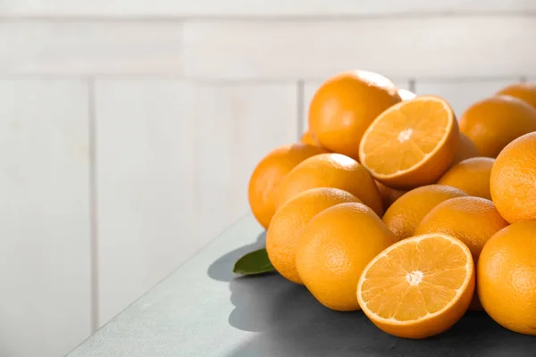 Fresh juicy oranges on table, space for text. Healthy fruits — Stock Photo, Image