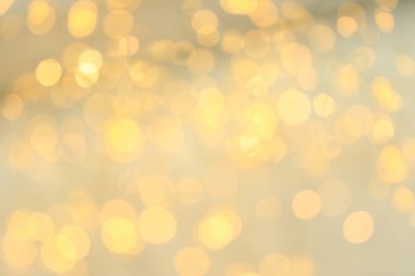 Açık renkli bokeh etkisi ile altın glitter