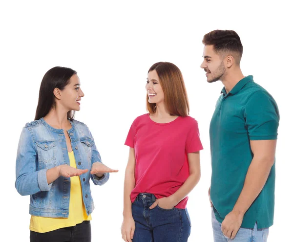 Amigos con discapacidad auditiva usando lenguaje de señas para la comunicación aislada en blanco — Foto de Stock