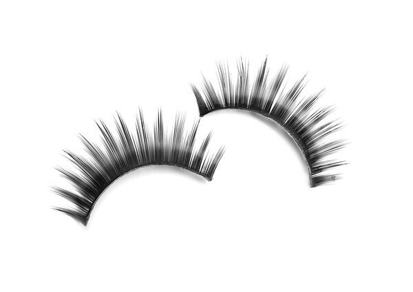 Beautiful pair of false eyelashes on white background, top view