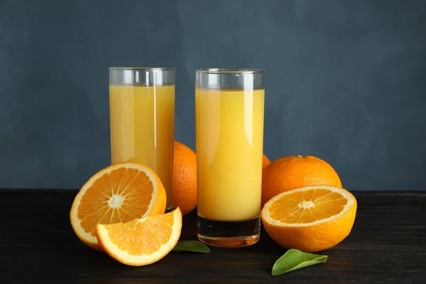 Composition with orange juice and fresh fruit on table — Stock Photo, Image