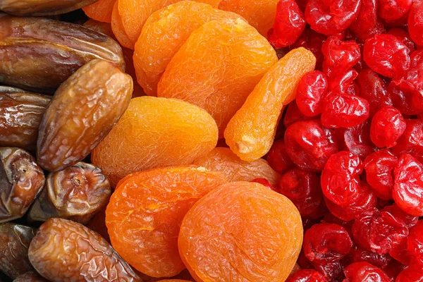 Různé sušené ovoce jako pozadí, pohled shora. Zdravý životní styl — Stock fotografie