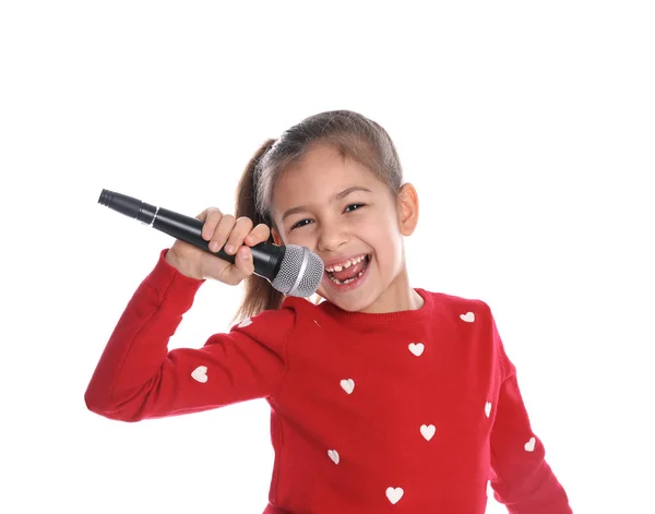 Nettes lustiges Mädchen mit Mikrofon auf weißem Hintergrund — Stockfoto