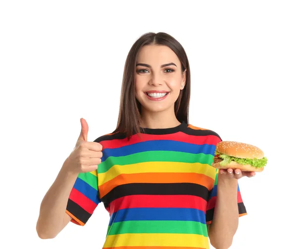 흰색 바탕에 맛 있는 햄버거와 함께 젊은 여성 — 스톡 사진
