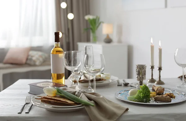 Festive Passover table setting with Torah at home. Pesach celebration — Stock Photo, Image