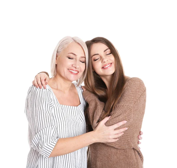 Portrait of young woman with her mature mother on white background — Stock Photo, Image