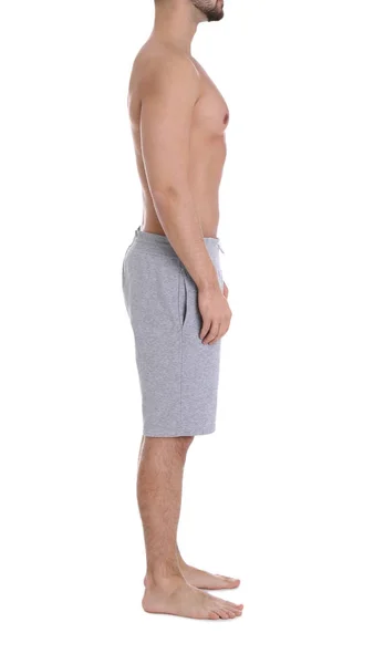 Junger Mann auf weißem Hintergrund, Nahaufnahme. Gewichtsverlust — Stockfoto