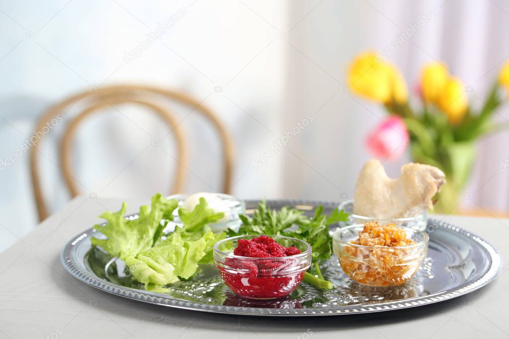 Traditional Passover (Pesach) Seder plate with symbolic meal on table indoors, space for text