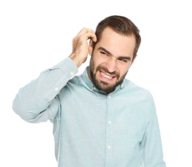 Young man scratching head on white background. Annoying itch clipart