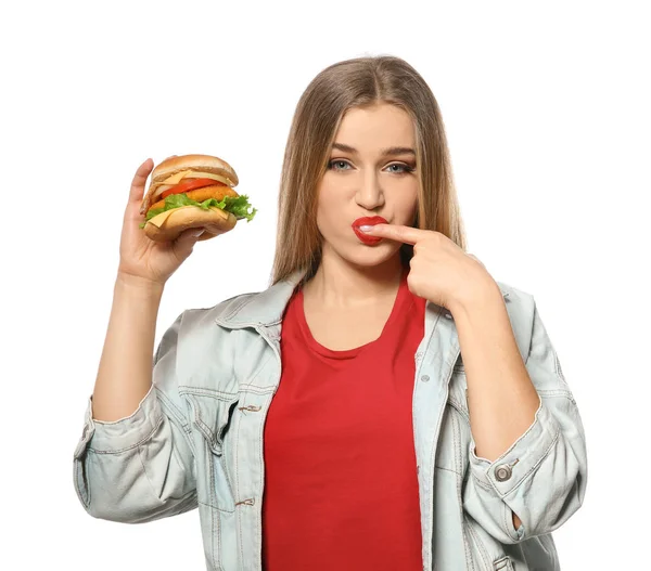 Mulher bonita com hambúrguer saboroso isolado em branco — Fotografia de Stock