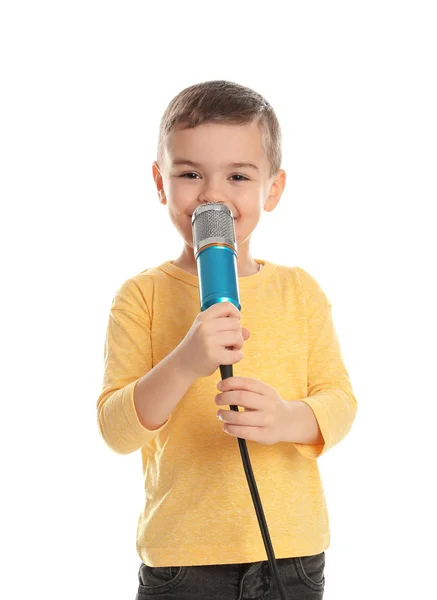Garoto engraçado bonito com microfone no fundo branco — Fotografia de Stock